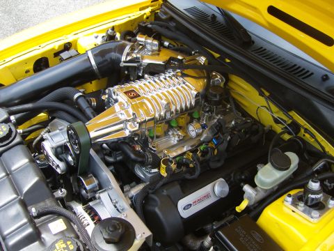 2007 Ford Mustang - The engine bay features a polished supercharger and yellow painted components.