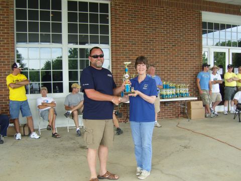 2007 Ford Mustang - Award ceremony with people receiving trophies outside a brick building.
