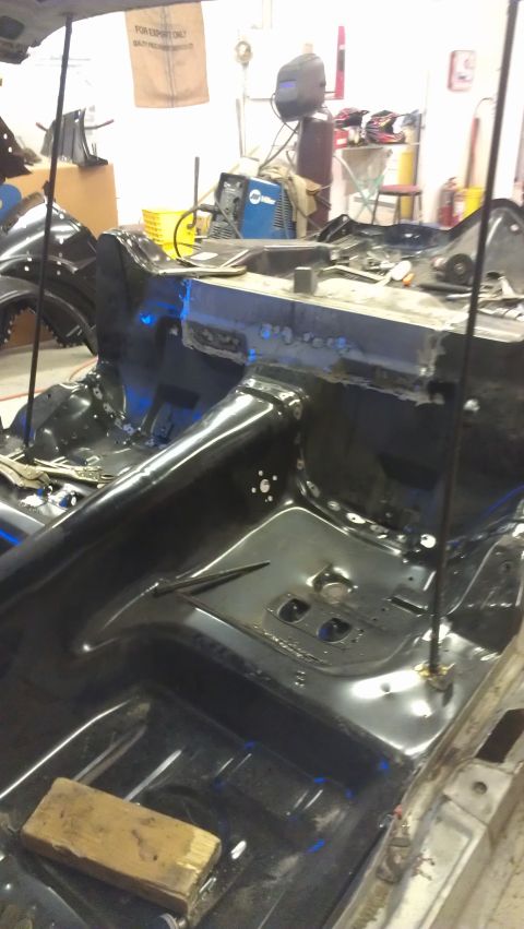 1980 Pontiac Trans Am - The interior chassis of a vehicle undergoing repairs, with visible welding work on the frame.