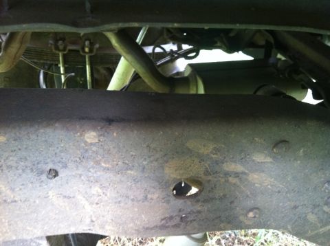 1991 Ford Bronco - Close-up view of the undercarriage, showing the frame and suspension parts of an unidentified vehicle.