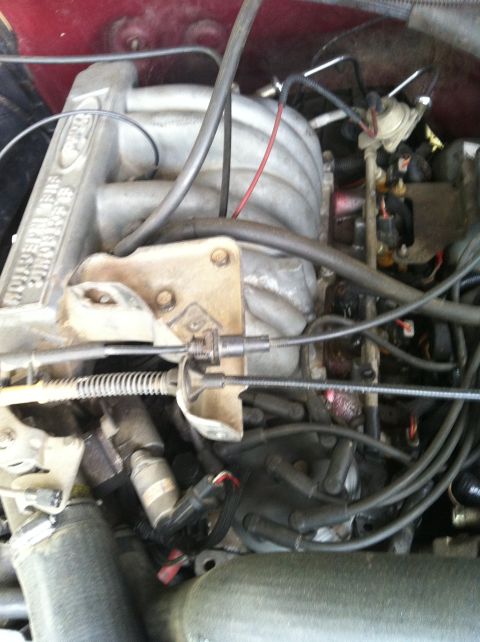 1991 Ford Bronco - Close-up view of an engine bay, showing the intake manifold and distributor.