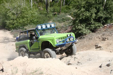 1991 Ford Bronco - Modified Ford Bronco navigates a rocky, off-road trail.
