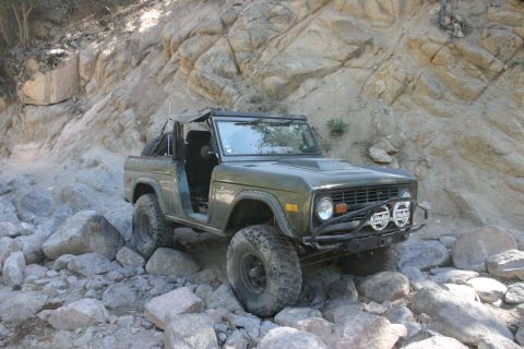 1991 Ford Bronco - This classic Ford Bronco is shown tackling a challenging, rocky terrain.