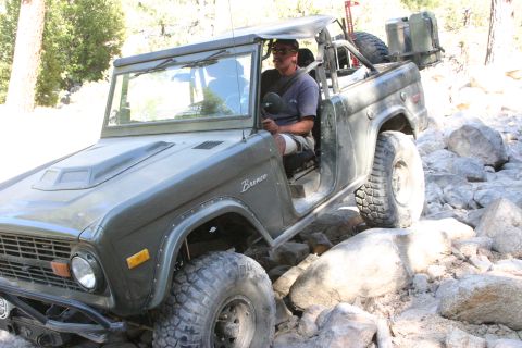 1991 Ford Bronco - Ford Bronco navigates a challenging rocky terrain, demonstrating its off-road capabilities.
