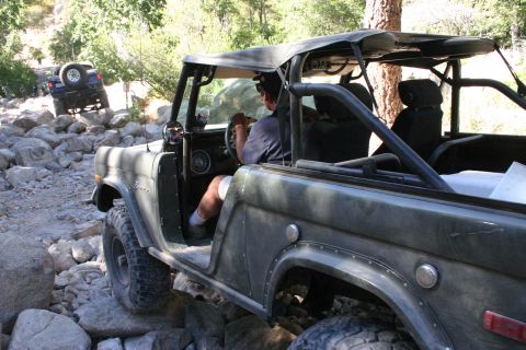 1991 Ford Bronco - This classic Ford Bronco navigates a rocky trail, its off-road capabilities.