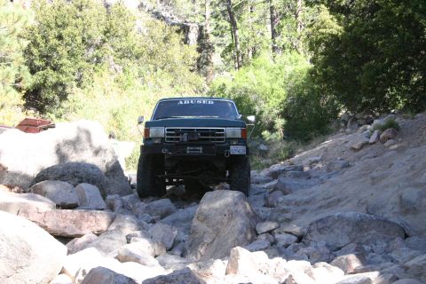 1991 Ford Bronco - This 1991 Ford Bronco is shown tackling a challenging rocky off-road path.