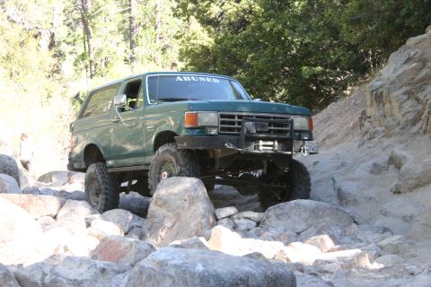 1991 Ford Bronco - This modified Ford Bronco navigates a rocky off-road trail.