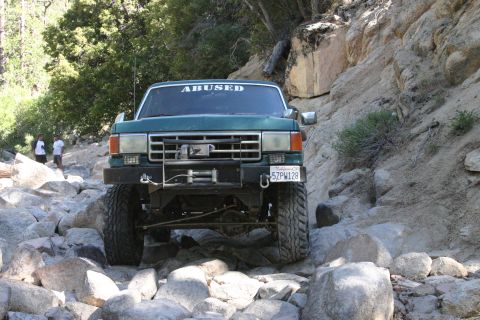 1991 Ford Bronco - This truck appears to be a 1987 Ford F-150, not a 1991 Bronco, as it navigates a difficult rocky path.