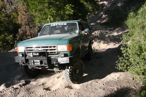 1991 Ford Bronco - This 1991 Ford Bronco navigates a off-road path.
