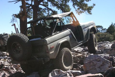 1991 Ford Bronco - Ford Bronco tackling rough terrain with a soft top removed.