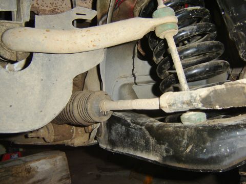 1987 Lincoln Mark VII - car resting jack stands under the ball joints.