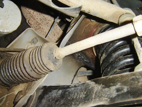 1987 Lincoln Mark VII - Close-up of the suspension system on a 1987 Lincoln Mark VII, showing mechanical parts.
