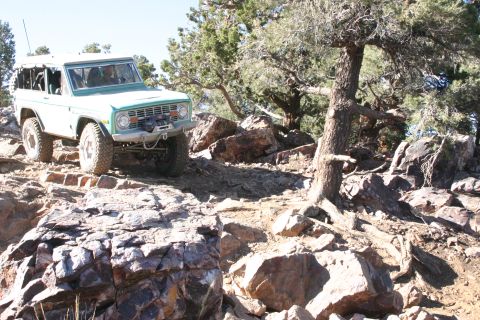 1991 Ford Bronco - This SUV navigates a challenging rocky trail, its off-road capabilities.