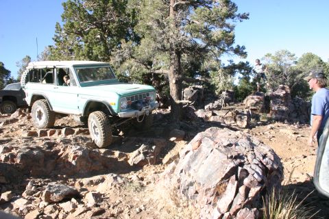 1991 Ford Bronco - This classic Ford Bronco navigates a challenging rocky terrain on an off-road trail.