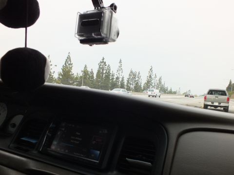 2003 Ford Crown Victoria - Cabin POV with a GoPro on the windshield, aftermarket head unit and fuzzy dice mirror.
