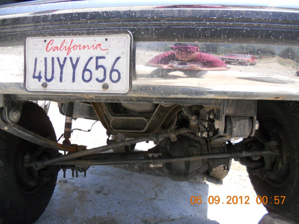 Rear bumper and suspension of a vehicle with California license plate 4UYY656