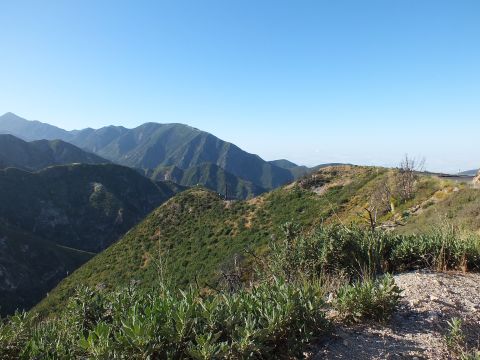 2003 Ford Crown Victoria - Layered chaparral-covered peaks recede into haze, scrub brush in the foreground