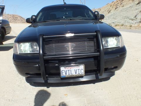 2003 Ford Crown Victoria - Head-on shot of the EVIL VIC Crown Victoria with grille guard on a paved road