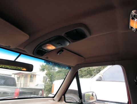 1994 Ford Bronco - Interior view of a 1994 Ford Bronco, including the overhead console and sun visors.