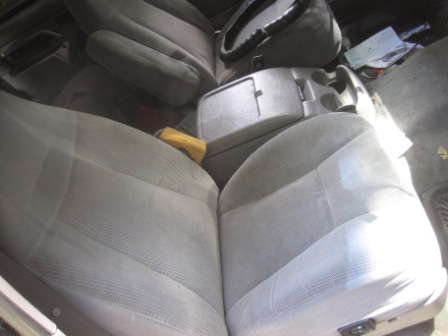1993 Ford Bronco - Interior view of a 1993 Ford Bronco, highlighting the seats and dashboard area.