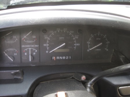1993 Ford Bronco - Interior view of dashboard gauges, including speedometer, tachometer, fuel, and temperature indicators.