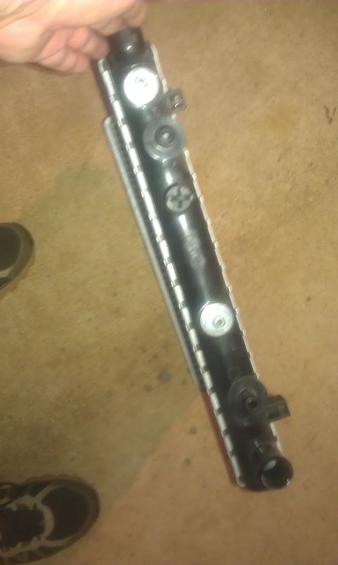 1991 Ford Festiva - A car radiator part is shown, likely for replacement or repair.