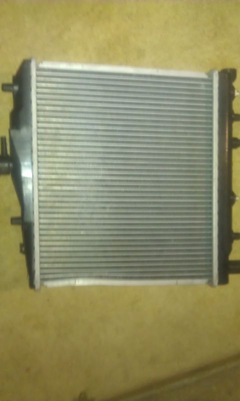 1991 Ford Festiva - A car radiator is shown, with no visible year or make information.
