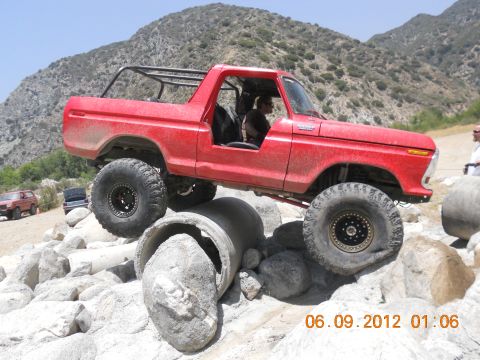 1986 Ford Bronco - Modified 1978 Ford Bronco navigates a difficult obstacle course on a sunny day.