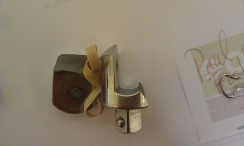 1965 Ford Mustang - A metal socket wrench adapter held together with a rubber band.