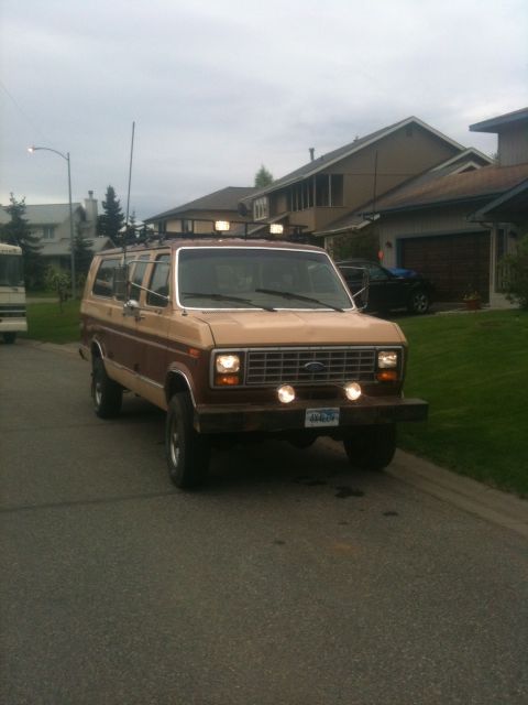 1990 Chevrolet Suburban - This van features a roof rack and auxiliary lights, suggesting it's equipped for adventure.