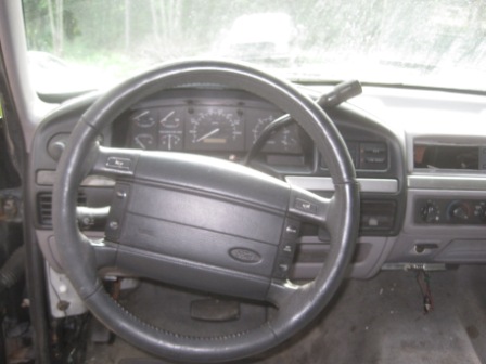 1993 Ford Bronco - Interior view of a 1993 Ford Bronco, focusing on the dashboard and steering wheel.