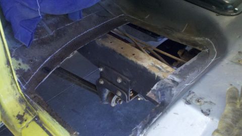 1978 Ford Bronco - The interior floor pan of a 1978 Ford Bronco shows signs of repair and modification.