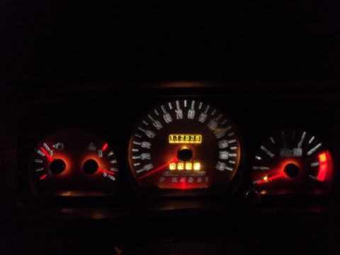 2000 Mercury Grand Marquis - The dashboard gauges show an odometer reading of 112,926 miles and the text 'GRAND MARQUIS'.