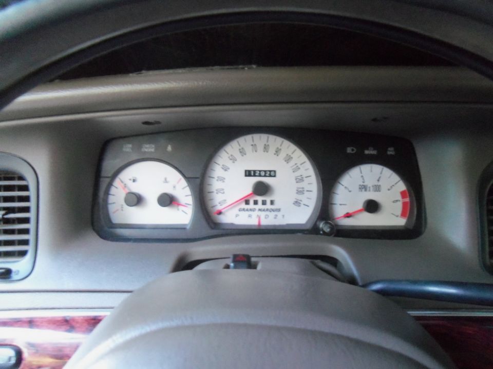 2000 Mercury Grand Marquis dashboard with odometer showing 112020 miles