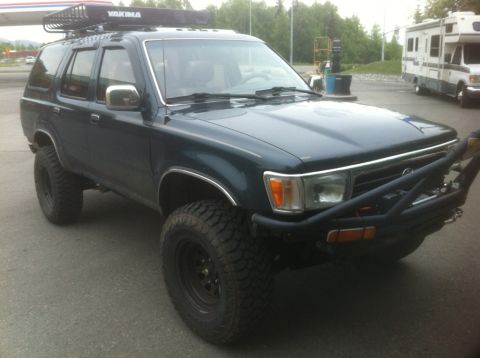 1990 Chevrolet Suburban - This SUV has large off-road tires and a custom front bumper.