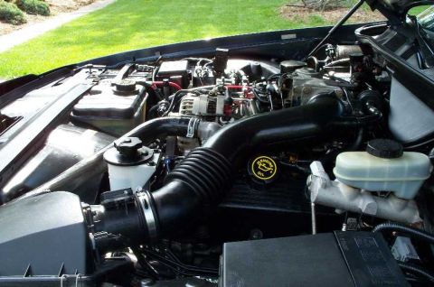 1998 Ford Crown Victoria - Engine bay of a 1998 Ford Crown Victoria, showing the air intake system and other engine components.