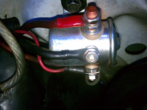 1993 Ford Bronco - Close-up view of a vehicle's starter solenoid and its wiring.