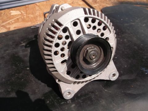 1971 Ford Ranchero - This is an automotive alternator, a component used to charge the battery and power electrical systems.
