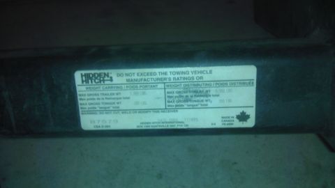 1983 Ferrari Enzo - This label details the weight carrying and distributing capacities for a trailer hitch, along with manufacturer and origin information.