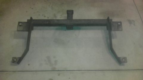 1983 Ferrari Enzo - This metal bracket appears to be a component from a vehicle, possibly for mounting or support.