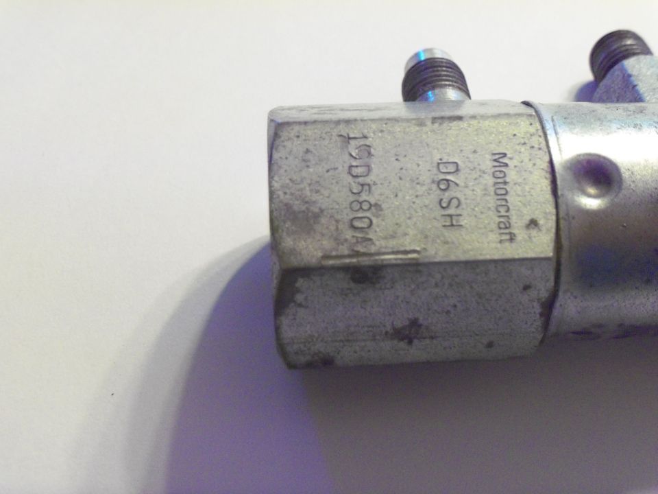 Motorcraft D6SH 19D580 brake valve block with threaded line ports on white background