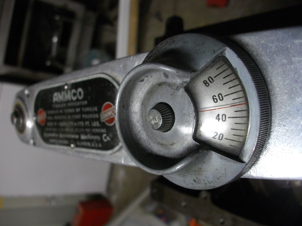 Close-up of an AMMCO torque wrench with a dial showing 40-60 ft-lbs