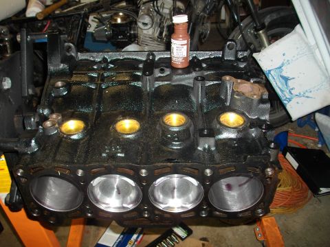 1989 Ford Probe - A close-up view of a rebuilt engine block, showing the cylinders and pistons ready for assembly.