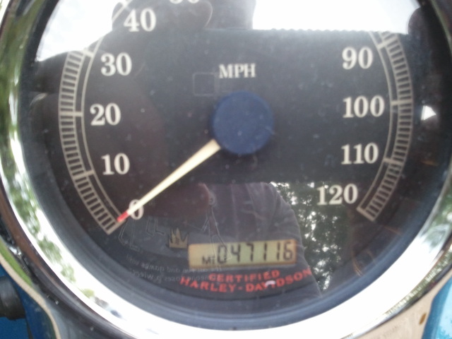 Motorcycle speedometer showing 47,116 miles and MPH markings up to 120