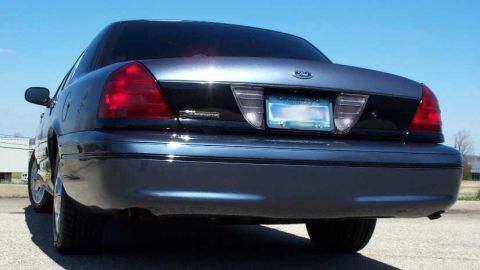 1998 Ford Crown Victoria - Rear view of a 1998 Ford Crown Victoria showing its taillights and license plate area.