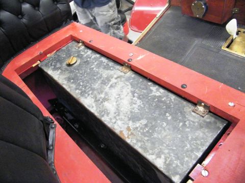 1906 Ford Model T - Close-up view of the interior of a vintage car, focusing on the fuel tank and seating area.