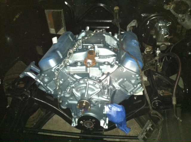 Engine assembly with chrome valve covers and intake manifold, suspended by chains
