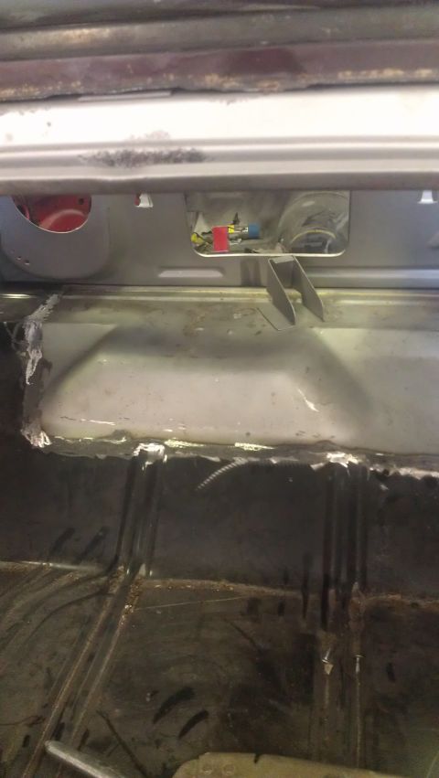 1970 Chevrolet Camaro - This photo shows the interior of a vehicle being worked on, with exposed metal and electrical components visible.