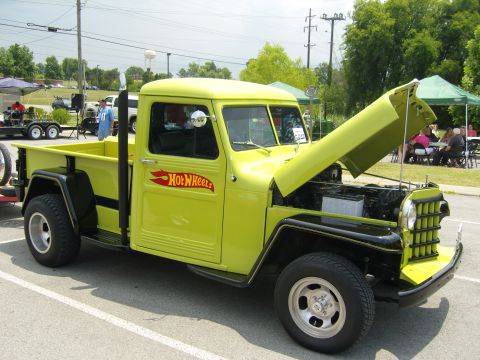 2007 Ford Mustang - A lime green pickup truck with a Hot Wheels logo is displayed with its hood open.