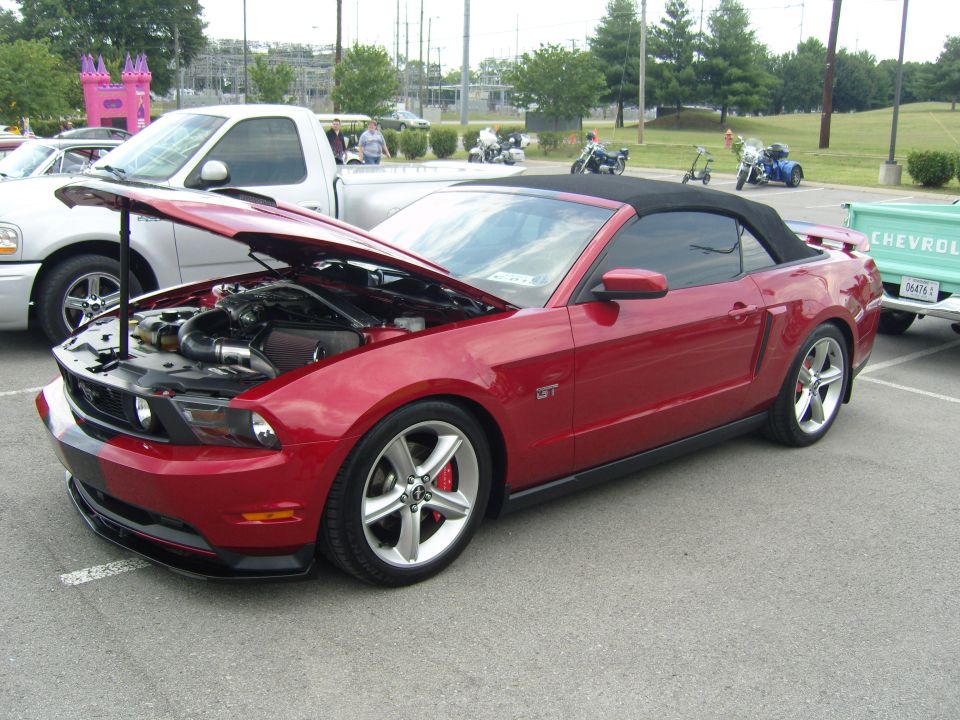 Red convertible Mustang GT with hood open